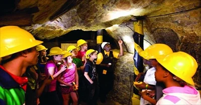 Visitors taking a tour inside the Gold Mine Gold Reef City